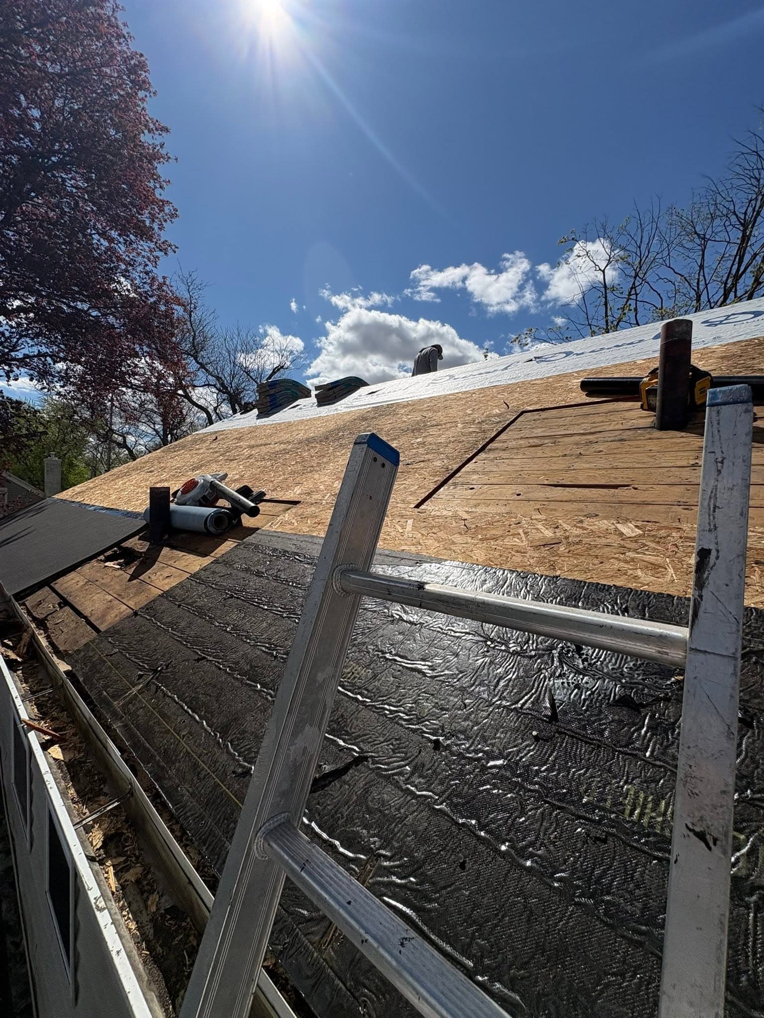 Residential roof deck prepared during an active roofing project